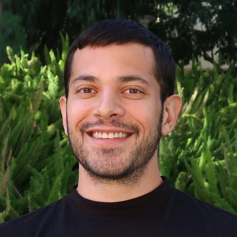 profile photo of Chris, a smiling man with light skin, short dark hair, and a short beard
